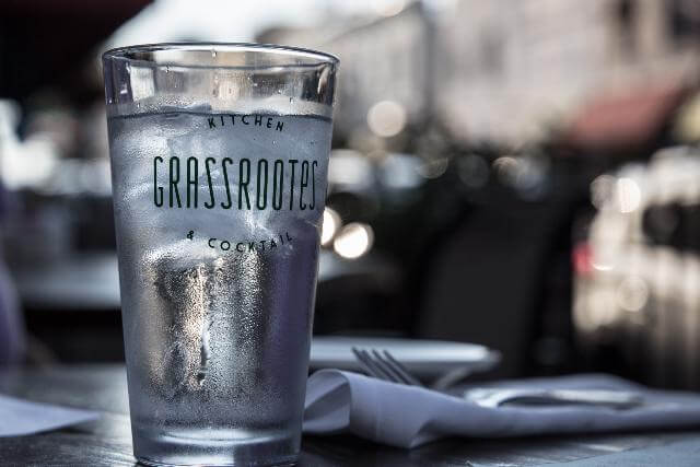 A clear glass with the label 