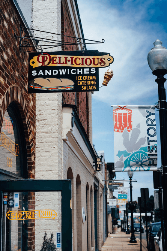 Street view of a café with a sign reading 