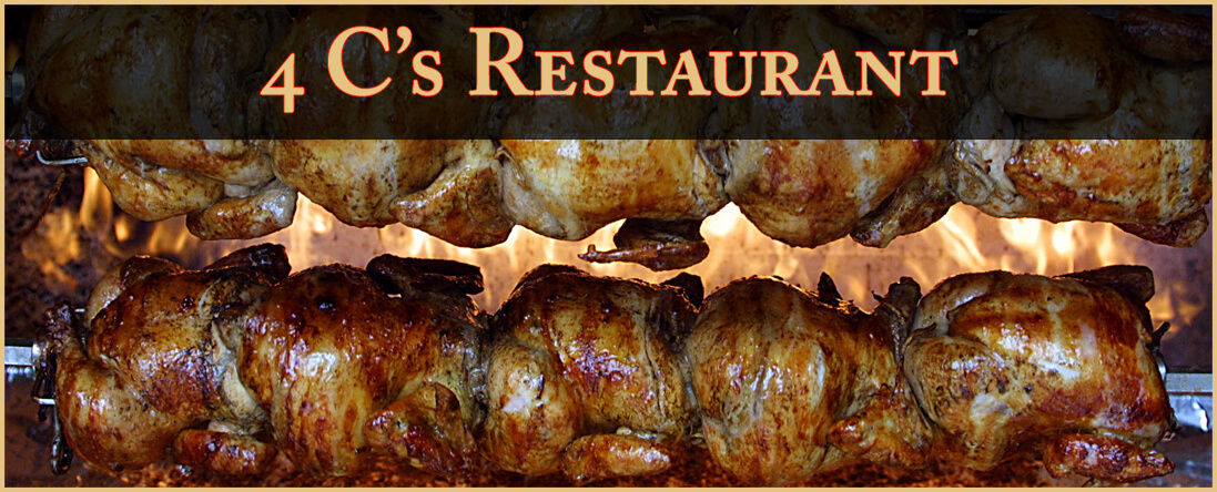 Two rows of rotisserie chickens roasting on spits with a golden, crispy skin. Above the chickens, a banner reads 