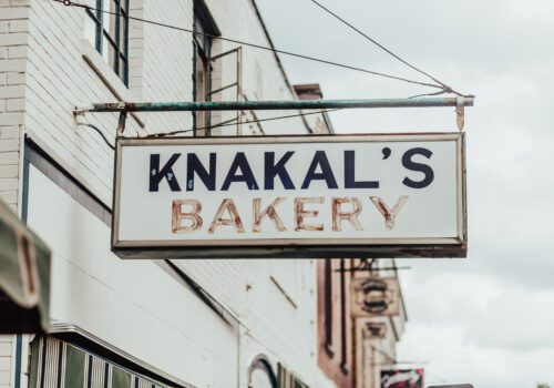 A white rectangular sign with 