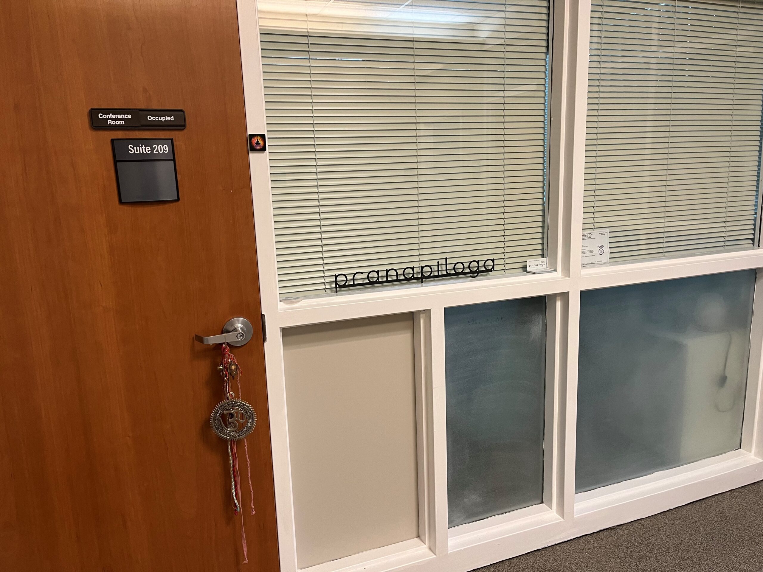 A closed office door labeled 