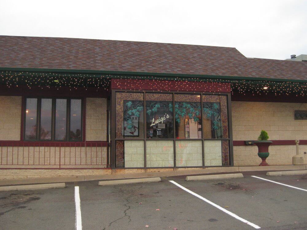 A storefront with a sign reading
