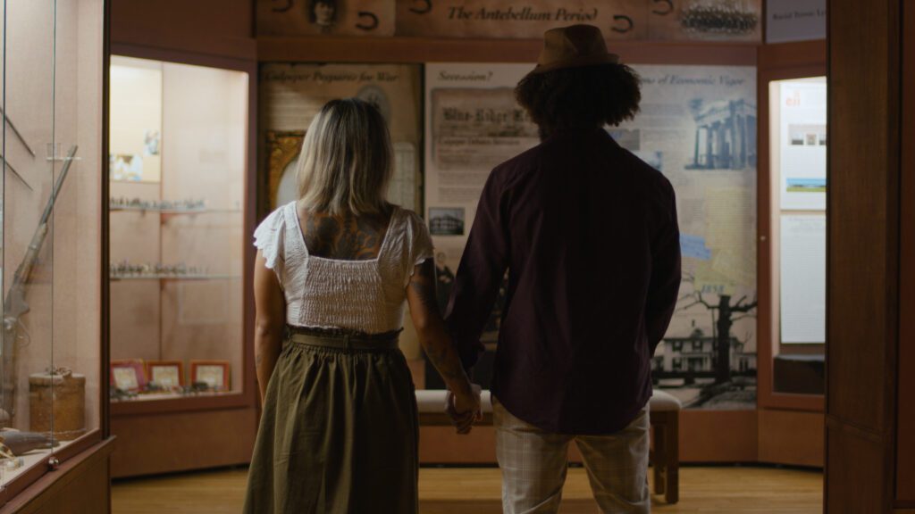 couple looking at museum exhibit