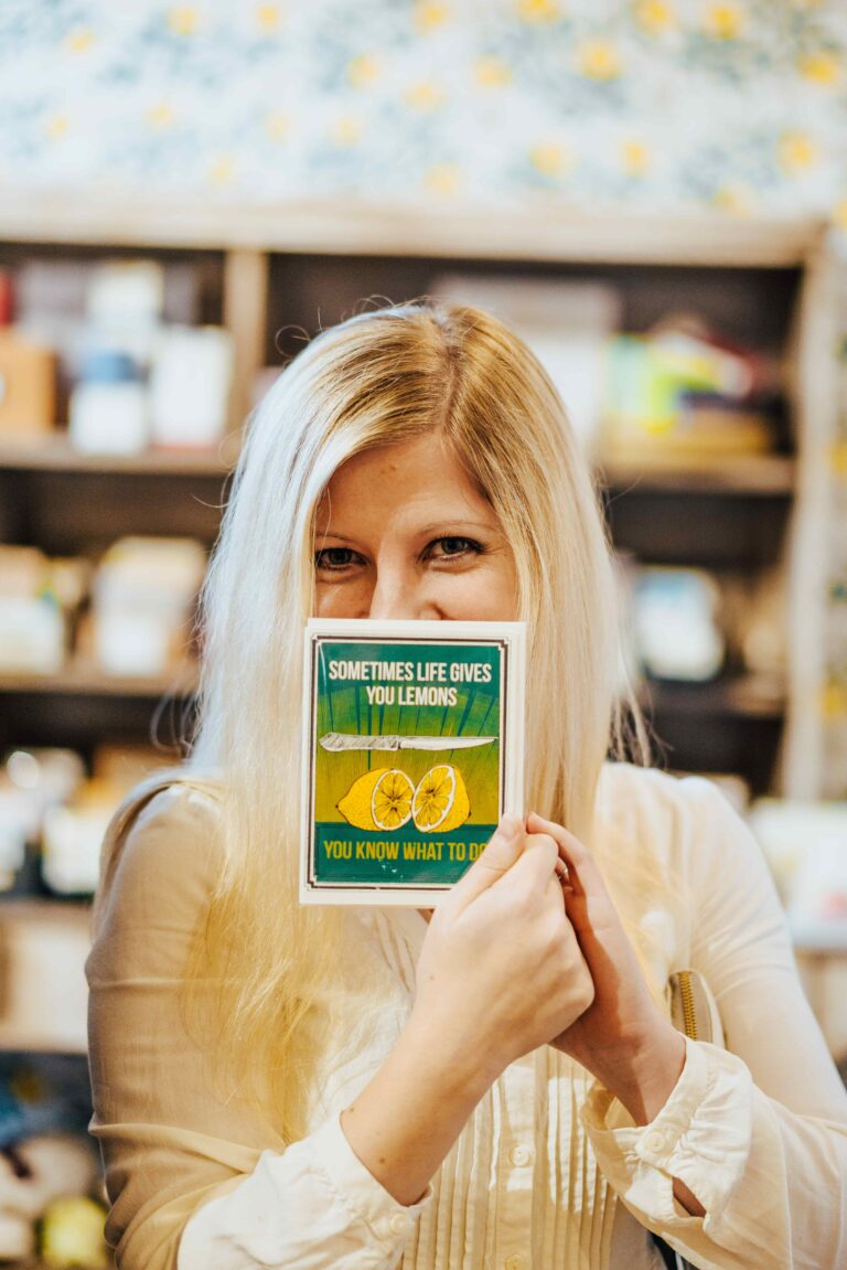 woman holding up a card