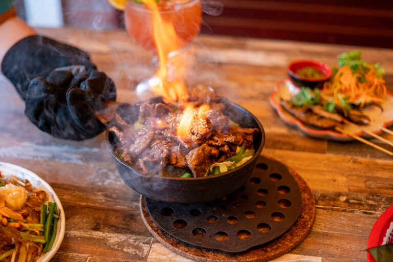 iron skillet of beef on fire