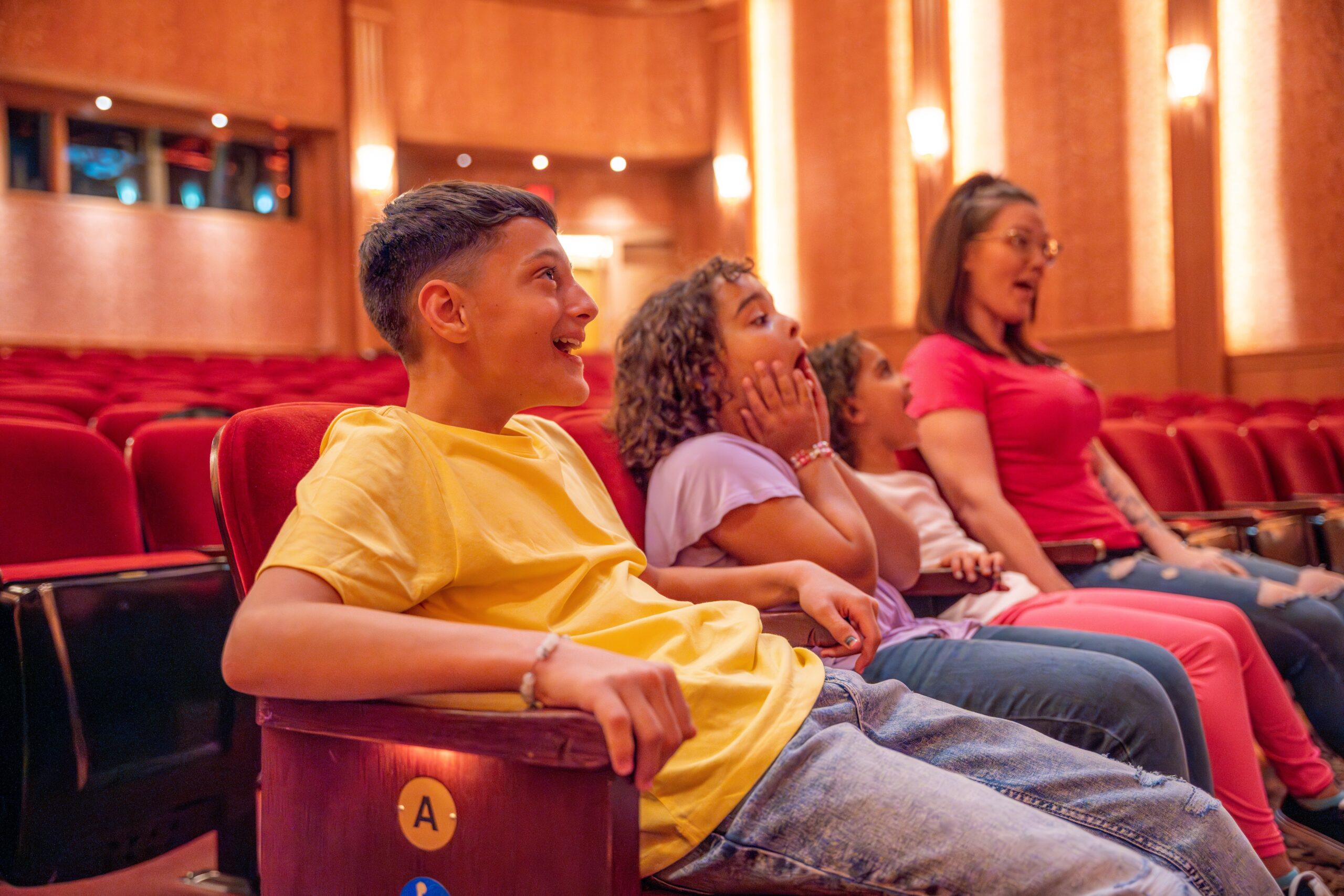 image of four people in a theater